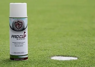 golf putting hole in white spray aerosol paint white pro cup